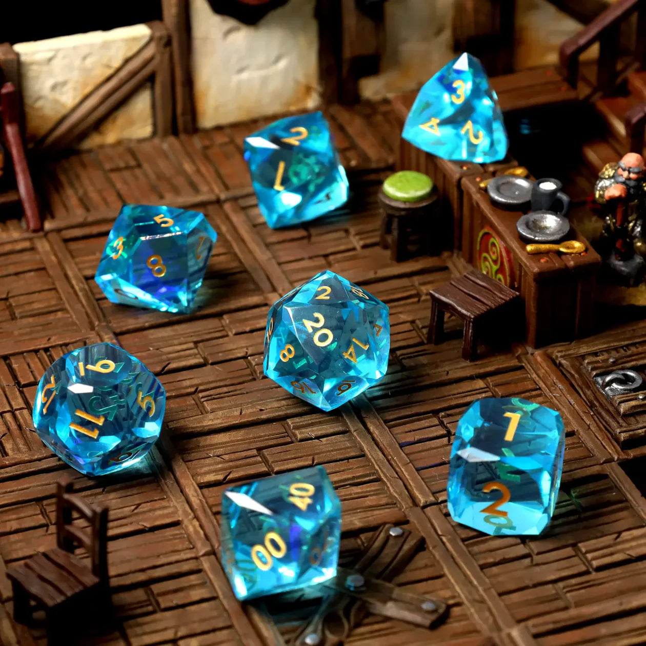 Blue transparent dice with numbers on a rustic wooden surface