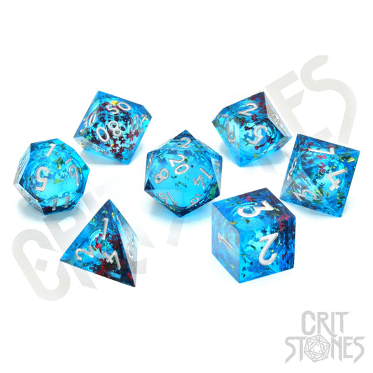 Set of blue polyhedral dice with star and galaxy design on a white background, featuring the brand 'Crit Stones'.